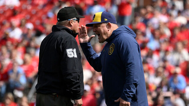 ST LOUIS, MISSOURI - APRIL 26: Pat Murphy #49 of the Milwaukee Brewers talks with umpire Marvin Hudson #51after a call during the seventh inning at Busch Stadium on April 26, 2025 in St Louis, Missouri.