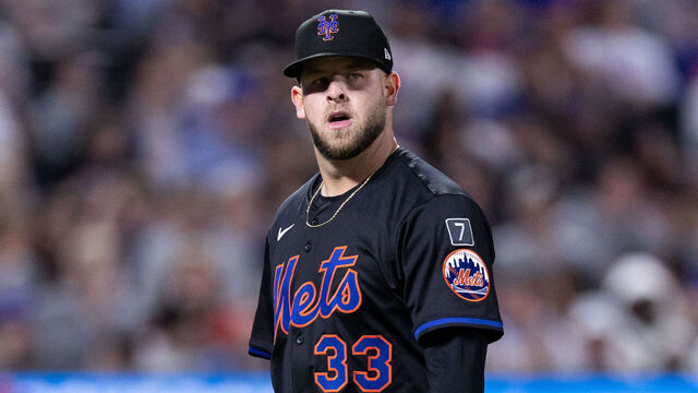 NEW YORK, NEW YORK - APRIL 22: A.J. Minter #33 of the New York Mets walks off the field during the seventh inning of the game against the Philadelphia Phillies at Citi Field on April 22, 2025 in New York City.
