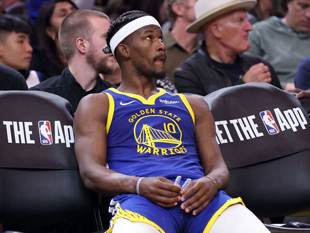 Golden State Warriors' Jimmy Butler III sits on bench during a video review in 4th quarter of Denver Nuggets' 114-105 win in NBA game at Chase Center in San Francisco on Monday, March 17, 2025.