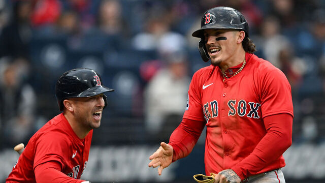 CLEVELAND, OHIO - APRIL 26: Jarren Duran #16 and Alex Bregman #2 of the Boston Red Sox celebrate Duran stealing home plate during the third inning of game two of a doubleheader against the Cleveland Guardians at Progressive Field on April 26, 2025 in Cleveland, Ohio.
