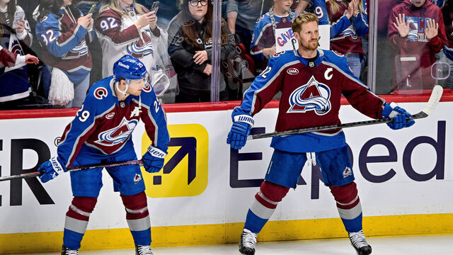 DENVER, CO - APRIL 23: Colorado Avalanche left wing Gabriel Landeskog (92) and center Nathan MacKinnon (29) warm up near supporters before game three of the Western Conference 1st Round between the Dallas Stars and the Colorado Avalanche at Ball Arena in Denver, Colorado on April 23, 2025.