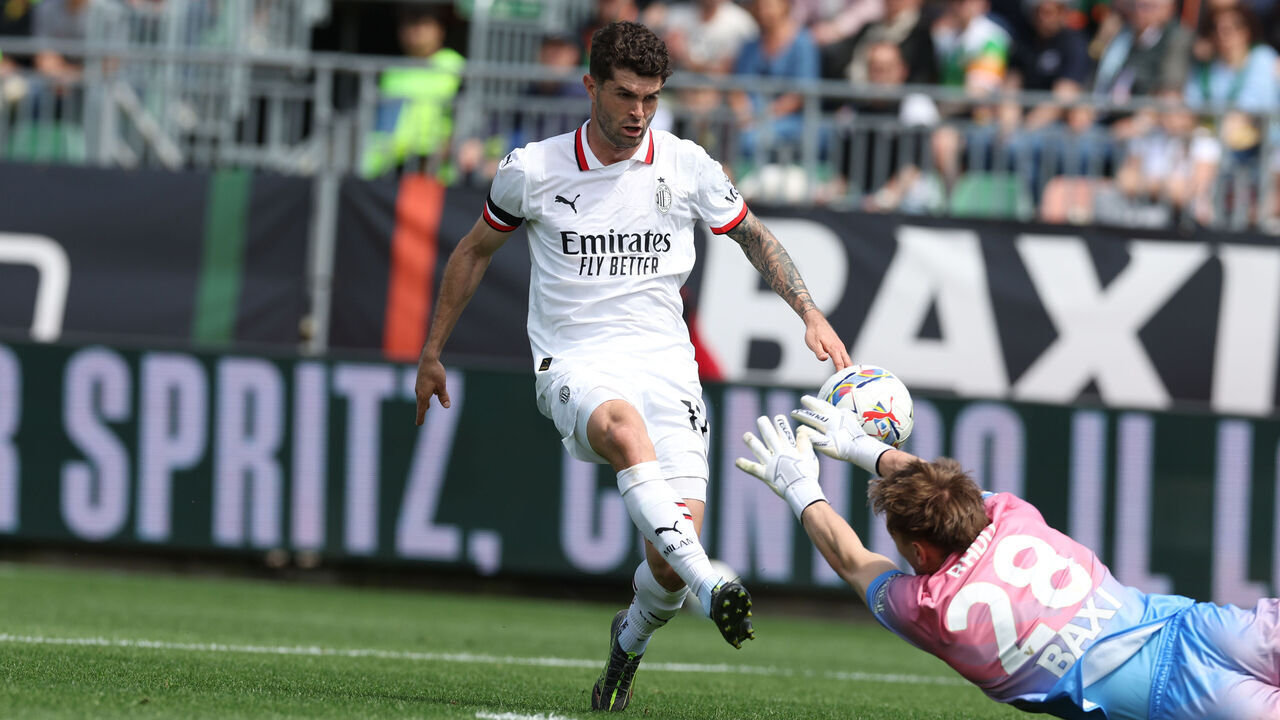 VENICE, ITALY - APRIL 27: Christian Pulisic of AC Milan shoots the ball trying to score a goal (offside) during the Serie A match between Venezia and Milan at Stadio Pier Luigi Penzo on April 27, 2025 in Venice, Italy.