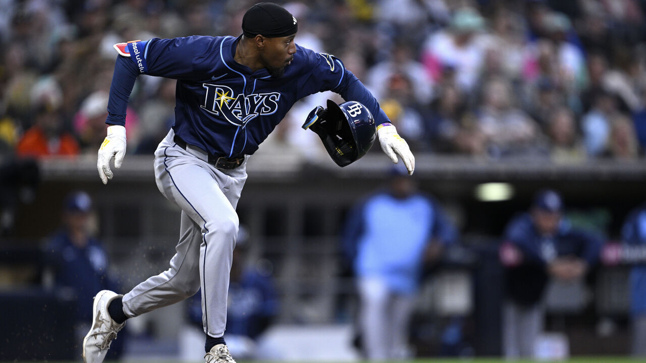 SAN DIEGO, CALIFORNIA - APRIL 25: Chandler Simpson #14 of the Tampa Bay Rays runs to first base on a single against the San Diego Padres during the third inning at Petco Park on April 25, 2025 in San Diego, California.