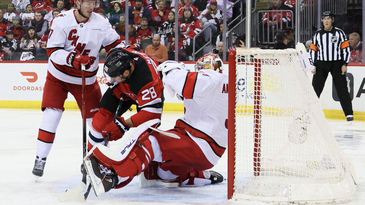 NEWARK, NEW JERSEY - APRIL 27: Andrei Svechnikov #37 of the Carolina Hurricanes watches as Timo Meier #28 of the New Jersey Devils runs into Frederik Andersen #31 of the Carolina Hurricanes during the second period in Game Four of the First Round of the 2025 Stanley Cup Playoffs at Prudential Center on April 27, 2025 in Newark, New Jersey.