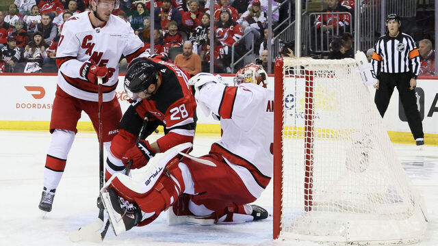 NEWARK, NEW JERSEY - APRIL 27: Andrei Svechnikov #37 of the Carolina Hurricanes watches as Timo Meier #28 of the New Jersey Devils runs into Frederik Andersen #31 of the Carolina Hurricanes during the second period in Game Four of the First Round of the 2025 Stanley Cup Playoffs at Prudential Center on April 27, 2025 in Newark, New Jersey.
