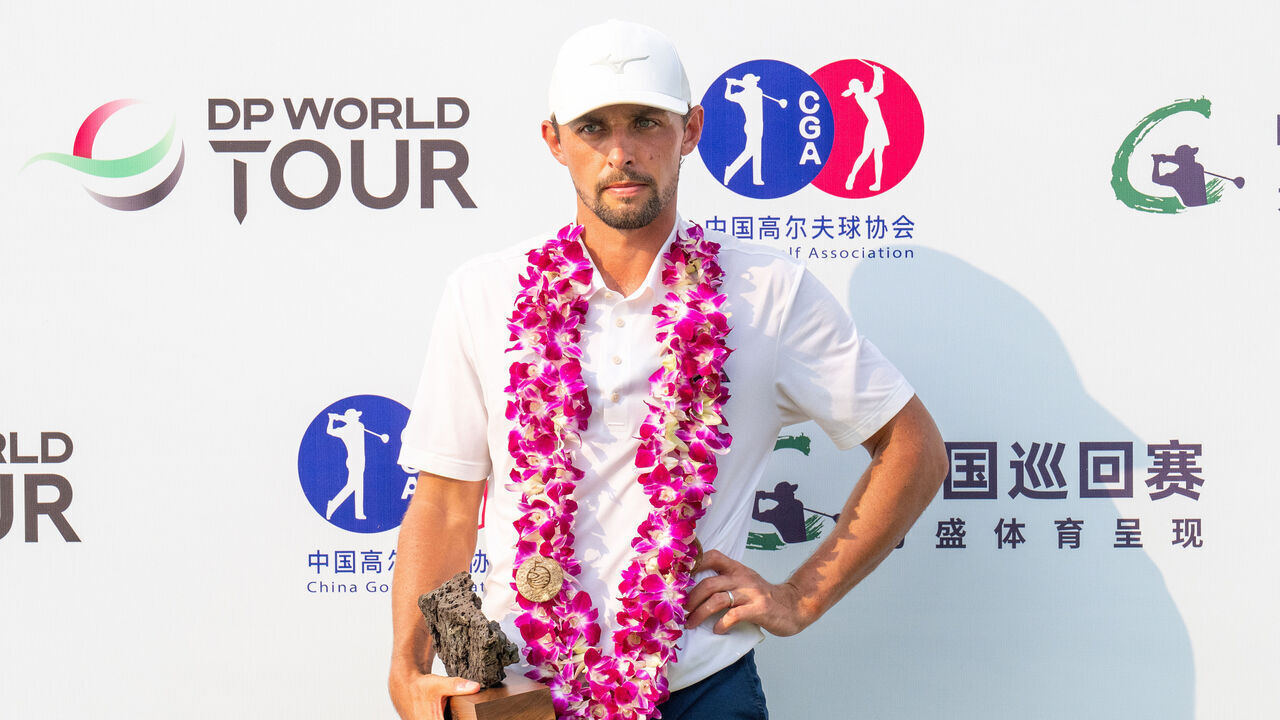 HAINAN ISLAND, CHINA - APRIL 27: Marco Penge of England holds the trophy after winning the Hainan Classic 2025 at Mission Hills' Blackstone Course on April 27, 2025 in Hainan Island, China.