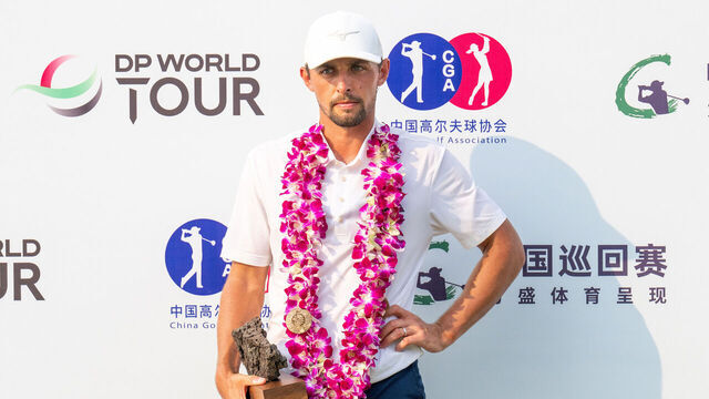 HAINAN ISLAND, CHINA - APRIL 27: Marco Penge of England holds the trophy after winning the Hainan Classic 2025 at Mission Hills' Blackstone Course on April 27, 2025 in Hainan Island, China.