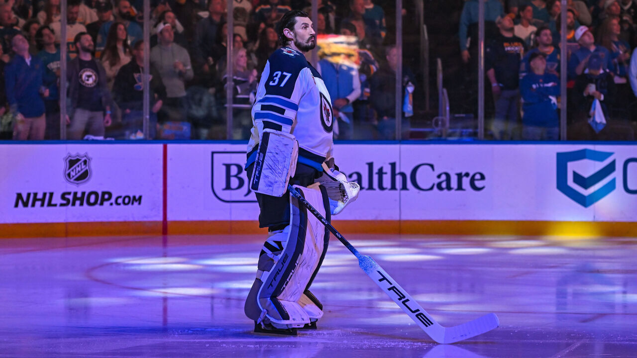 ST. LOUIS, MO - APRIL 24: Winnipeg Jets goaltender Connor Hellebuyck (37) stands for the National Anthems during the Stanley Cup Playoffs round one game three where the St. Louis Blues hosted the Winnipeg Jets on Thursday April 24, 2025, at the Enterprise Center in St. Louis MO