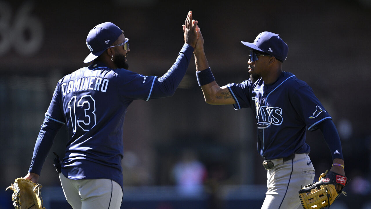SAN DIEGO, CALIFORNIA - APRIL 27: Junior Caminero #13 and Chandler Simpson #14 of the Tampa Bay Rays celebrate on the field after defeating the San Diego Padres 4-2 at Petco Park on April 27, 2025 in San Diego, California.