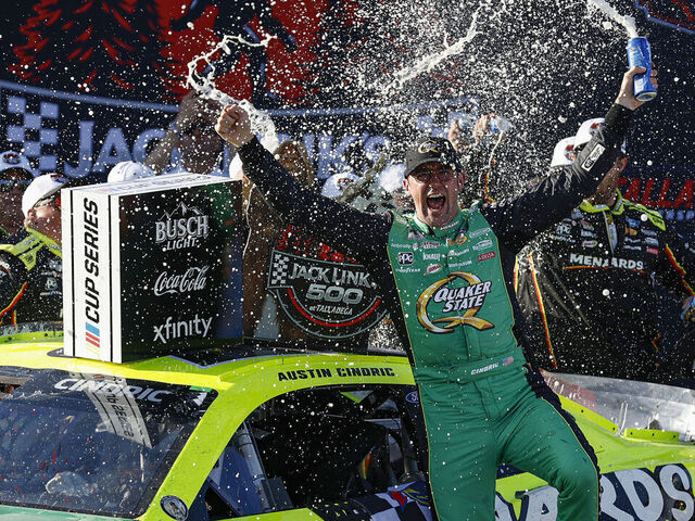 TALLADEGA, ALABAMA - APRIL 27: Austin Cindric, driver of the #2 Menards/Quaker State Ford, celebrates in victory lane after winning the NASCAR Cup Series Jack Link's 500 at Talladega Superspeedway on April 27, 2025 in Talladega, Alabama.