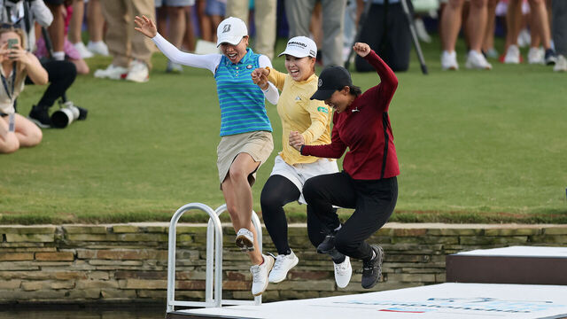 THE WOODLANDS, TEXAS - APRIL 27: Mao Saigo of Japan (C) jumps in the pond on the 18th hole after winning The Chevron Championship 2025 in a playoff at The Club at Carlton Woods on April 27, 2025 in The Woodlands, Texas.