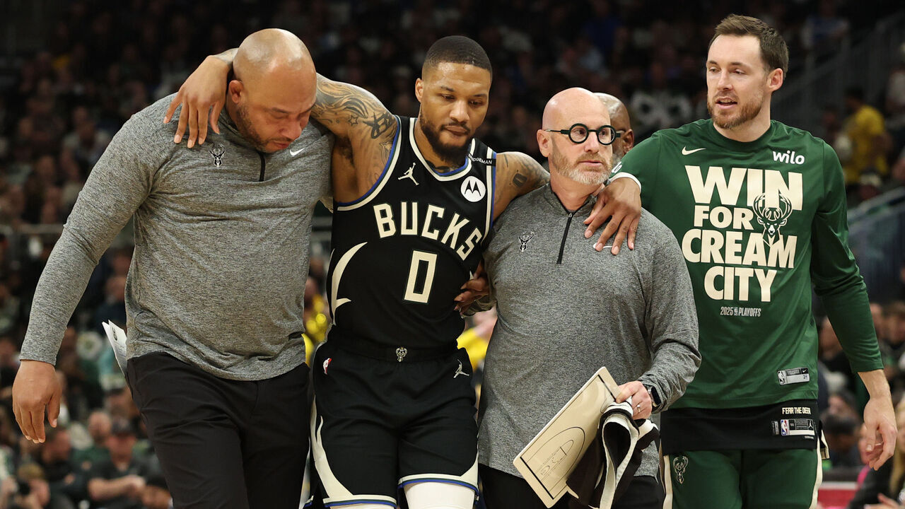 MILWAUKEE, WISCONSIN - APRIL 27: Damian Lillard #0 of the Milwaukee Bucks is helped off the court after an apparent injury during the first quarter in Game Four of the Eastern Conference First Round NBA Playoffs against the Indiana Pacers at Fiserv Forum on April 27, 2025 in Milwaukee, Wisconsin.