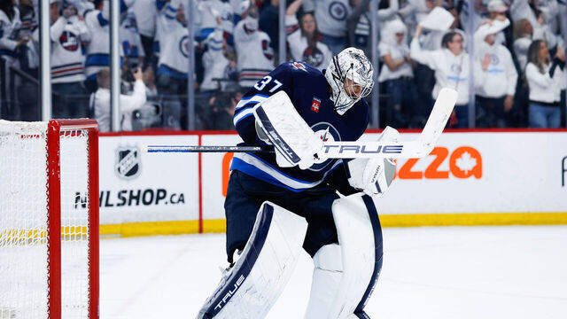 WINNIPEG, MB - APRIL 21: Winnipeg Jets goalie Connor Hellebuyck (37) celebrates his win against the St. Louis Blues at the end of the third period of game 2 of the first round of the Stanley Cup Playoffs between the Winnipeg Jets and the St. Louis Blues on April 21,2025 at the Canada Life Centre Winnipeg, Manitoba.