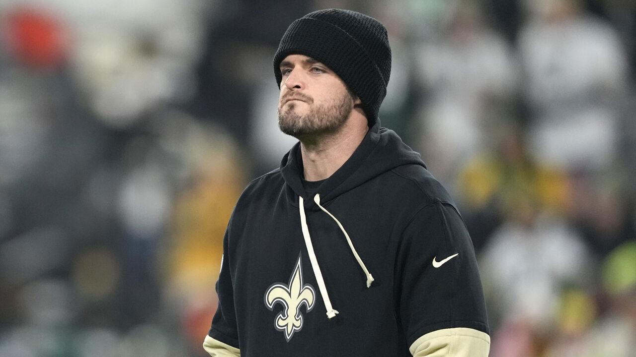 GREEN BAY, WISCONSIN - DECEMBER 23: Derek Carr #4 of the New Orleans Saints looks on before the game against the Green Bay Packers at Lambeau Field on December 23, 2024 in Green Bay, Wisconsin.
