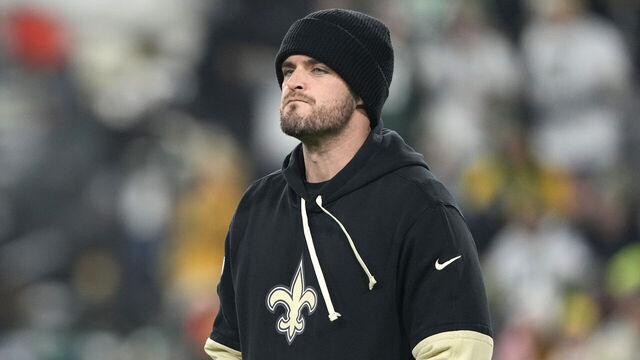 GREEN BAY, WISCONSIN - DECEMBER 23: Derek Carr #4 of the New Orleans Saints looks on before the game against the Green Bay Packers at Lambeau Field on December 23, 2024 in Green Bay, Wisconsin.
