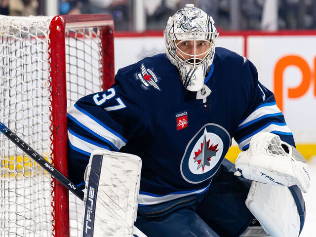 WINNIPEG, CANADA - APRIL 21: Connor Hellebuyck #37 of the Winnipeg Jets warms up before Game Two of the First Round of the 2025 Stanley Cup Playoffs against the St. Louis Blues at Canada Life Centre on April 21, 2025 in Winnipeg, Canada.