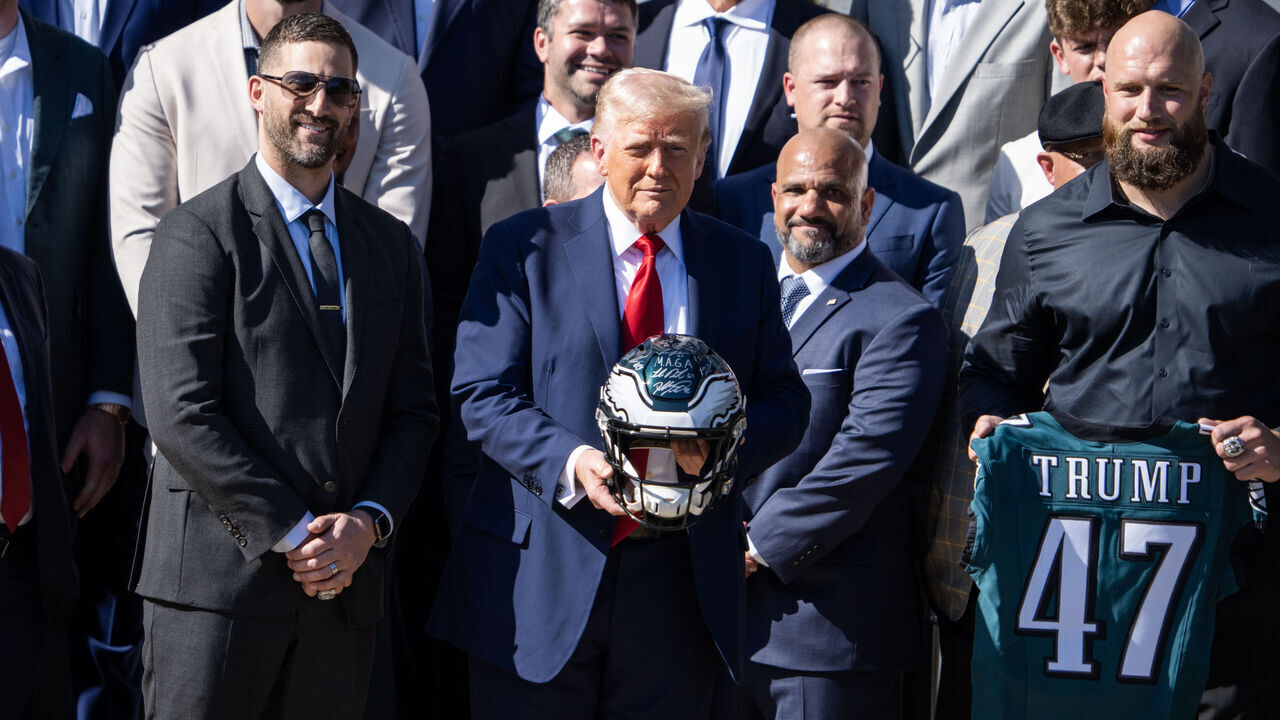 UNITED STATES - APRIL 28: President Donald Trump poses with offensive tackle Lane Johnson, right, and head coach Nick Sirianni, left, during a ceremony with the Philadelphia Eagles, winners of the 2025 Super Bowl, on the South Lawn of the White House on Monday, April 28, 2025. (Tom Williams/CQ-Roll Call, Inc via Getty Images)