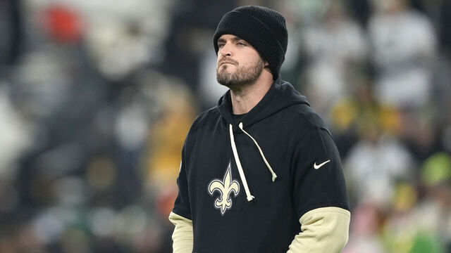 GREEN BAY, WISCONSIN - DECEMBER 23: Derek Carr #4 of the New Orleans Saints looks on before the game against the Green Bay Packers at Lambeau Field on December 23, 2024 in Green Bay, Wisconsin.