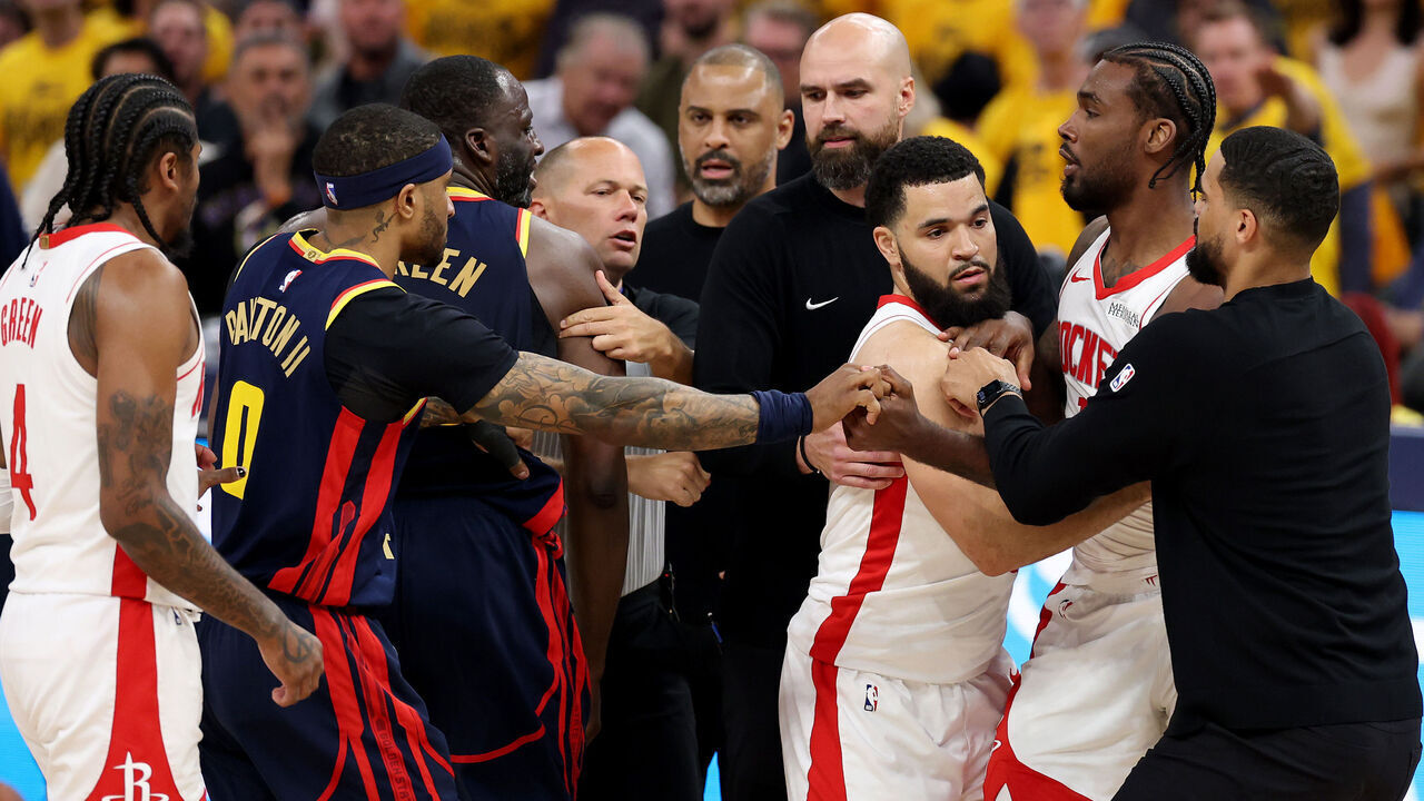 SAN FRANCISCO, CALIFORNIA - APRIL 28: Draymond Green #23 of the Golden State Warriors and Tari Eason #17 of the Houston Rockets fight during the second quarter in Game Four of the Western Conference First Round NBA Playoffs at Chase Center on April 28, 2025 in San Francisco, California.