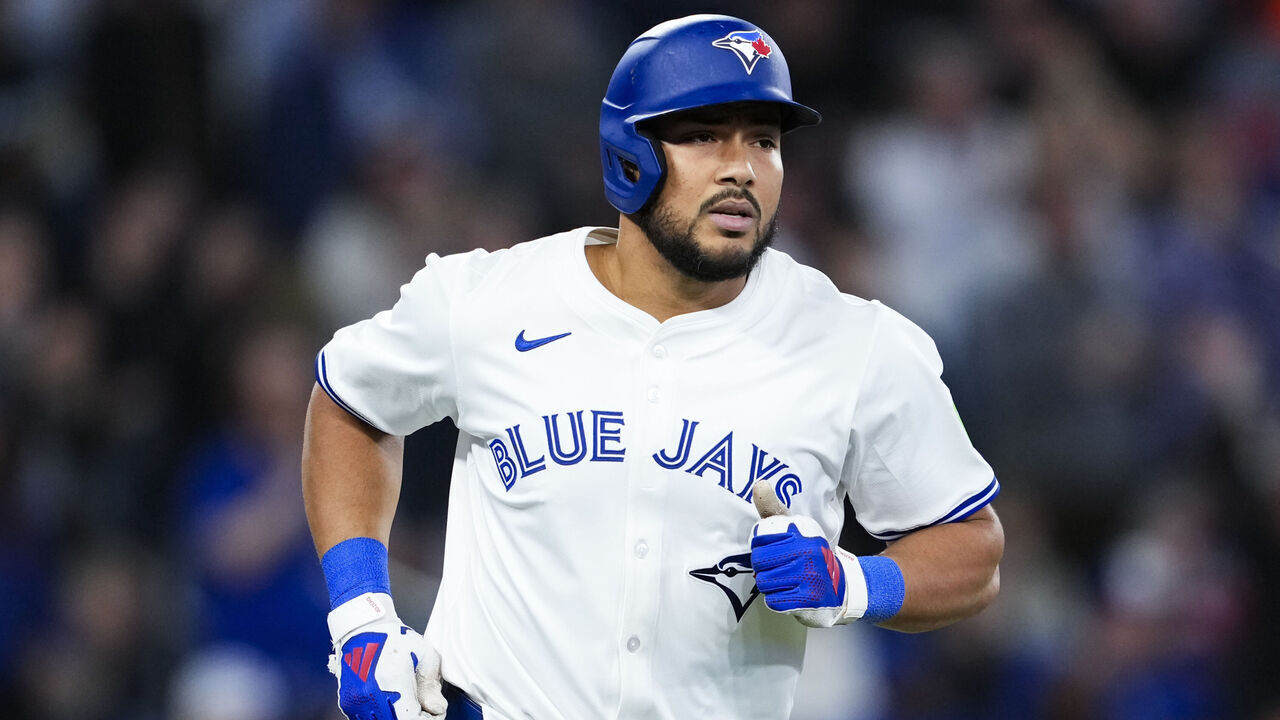 TORONTO, ON - APRIL 15: Anthony Santander #25 of the Toronto Blue Jays hits a three run home run against the Atlanta Braves during the fifth inning in their MLB game at the Rogers Centre on April 15, 2025 in Toronto, Ontario, Canada. All players are wearing the number 42 in honor of Jackie Robinson Day.