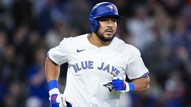 TORONTO, ON - APRIL 15: Anthony Santander #25 of the Toronto Blue Jays hits a three run home run against the Atlanta Braves during the fifth inning in their MLB game at the Rogers Centre on April 15, 2025 in Toronto, Ontario, Canada. All players are wearing the number 42 in honor of Jackie Robinson Day.