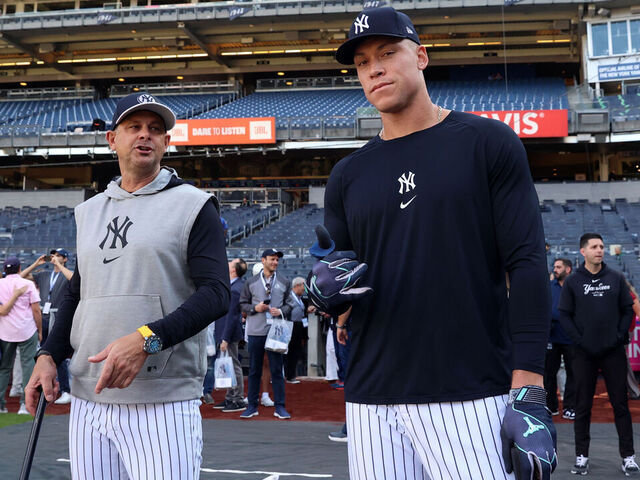 NEW YORK, NY - AUGUST 21: Manager, Aaron Boone #17 of the New York Yankees and Aaron Judge #99 talk before the game against the Cleveland Guardians at Yankee Stadium on August 21, 2024, in New York, New York.