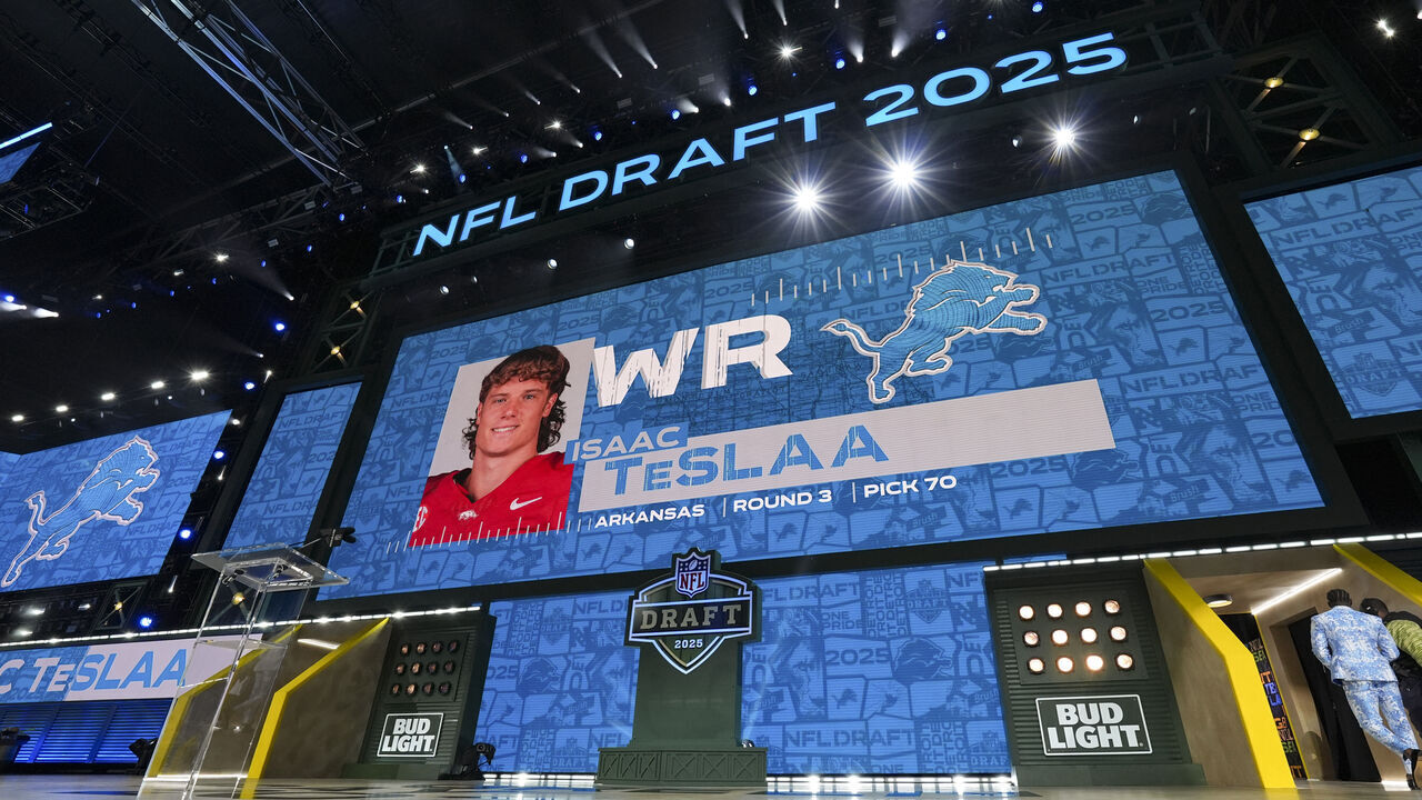 GREEN BAY, WISCONSIN - APRIL 25: A screen shows Arkansas wide receiver Isaac TeSlaa after being selected by the Detroit Lions with the 70th overall pick during the third round of the 2025 NFL Draft on April 25, 2025 in Green Bay, Wisconsin.