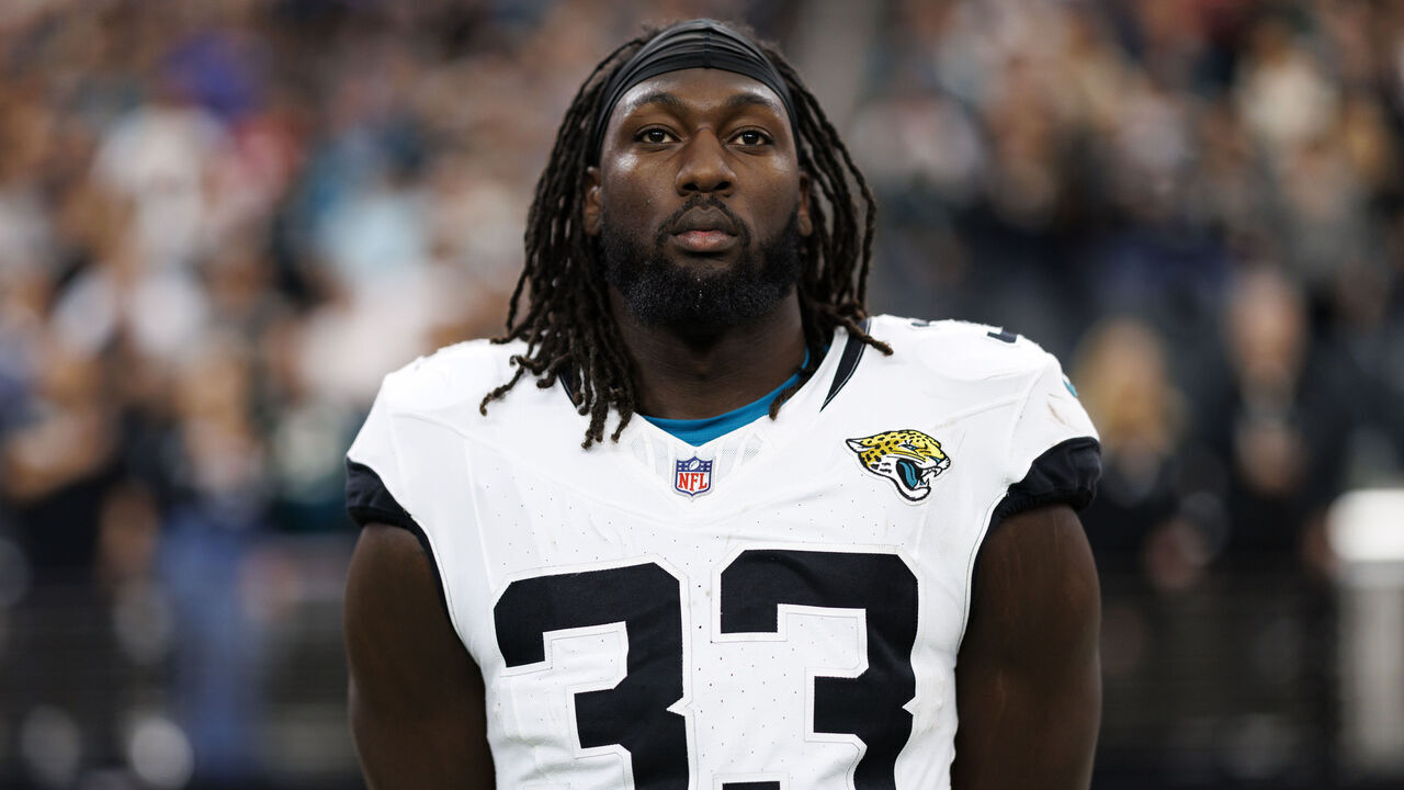 LAS VEGAS, NEVADA - DECEMBER 22: Linebacker Devin Lloyd #33 of the Jacksonville Jaguars stands on the sidelines during the national anthem prior to an NFL football game against the Las Vegas Raiders, at Allegiant Stadium on December 22, 2024 in Las Vegas, Nevada.