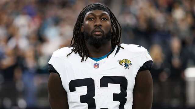 LAS VEGAS, NEVADA - DECEMBER 22: Linebacker Devin Lloyd #33 of the Jacksonville Jaguars stands on the sidelines during the national anthem prior to an NFL football game against the Las Vegas Raiders, at Allegiant Stadium on December 22, 2024 in Las Vegas, Nevada.
