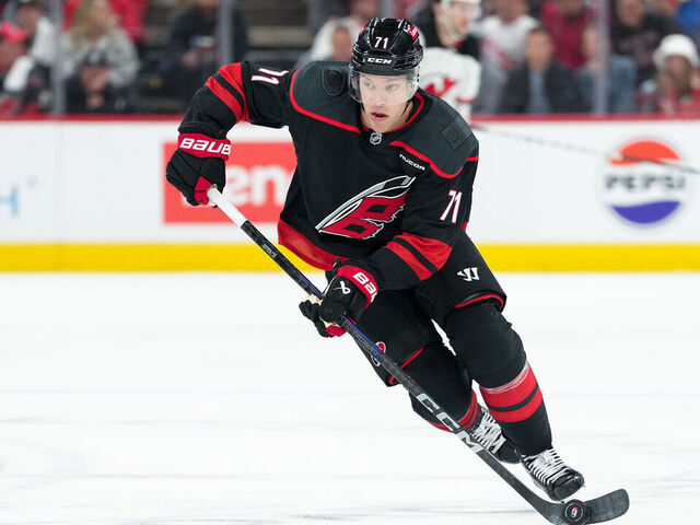 RALEIGH, NORTH CAROLINA - APRIL 20: Taylor Hall #71 of the Carolina Hurricanes controls the puck against the New Jersey Devils in Game One of the First Round of the 2025 Stanley Cup Playoffs at Lenovo Center on April 20, 2025 in Raleigh, North Carolina.