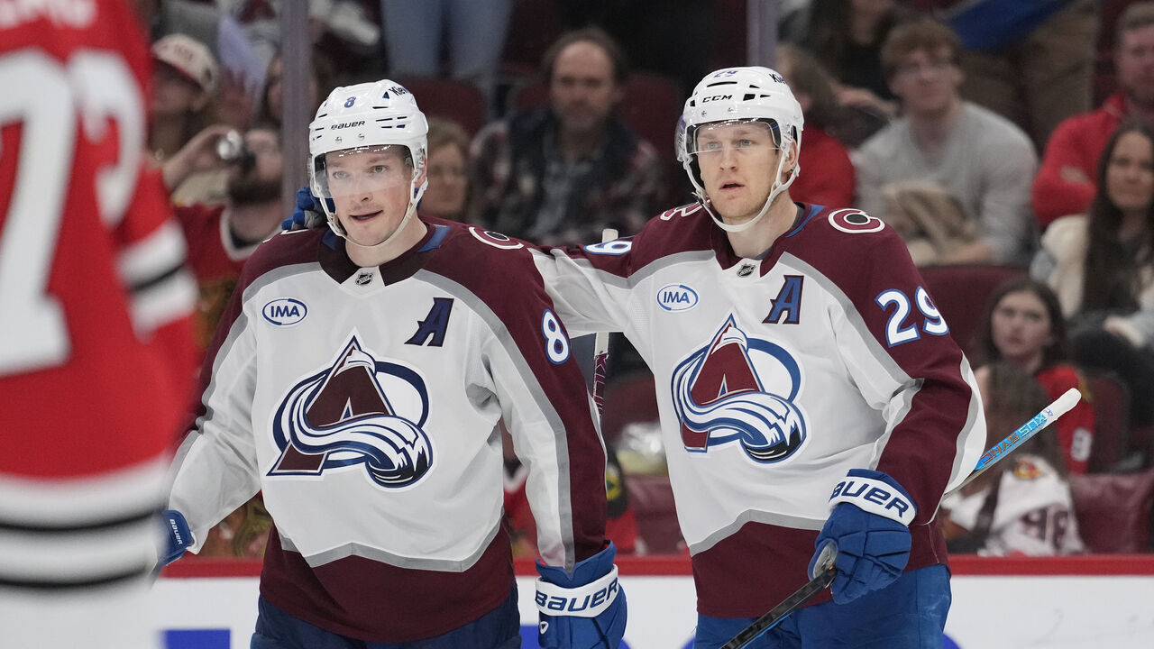 CHICAGO, ILLINOIS - APRIL 02: Cale Makar #8 of the Colorado Avalanche celebrates with teammate Nathan MacKinnon #29 after scoring a goal against the Chicago Blackhawks during the third period at the United Center on April 02, 2025 in Chicago, Illinois.