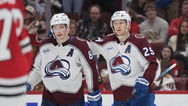 CHICAGO, ILLINOIS - APRIL 02: Cale Makar #8 of the Colorado Avalanche celebrates with teammate Nathan MacKinnon #29 after scoring a goal against the Chicago Blackhawks during the third period at the United Center on April 02, 2025 in Chicago, Illinois.
