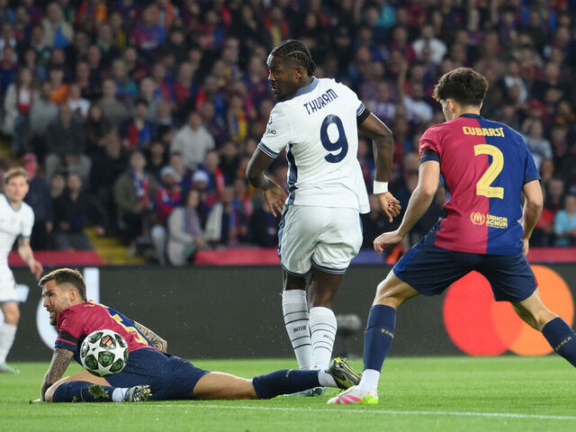 BARCELONA, SPAIN - APRIL 30: Marcus Thuram of FC Internazionale scores his team's first goal whilst under pressure from Inigo Martinez and Pau Cubarsi of FC Barcelona during the UEFA Champions League 2024/25 Semi Final First Leg match between FC Barcelona and FC Internazionale Milano at Estadi Olimpic Lluis Companys on April 30, 2025 in Barcelona, Spain.