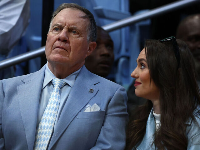 CHAPEL HILL, NORTH CAROLINA - MARCH 08: North Carolina Tar Heels football head coach Bill Belichick and his girlfriend Jordon Hudson look on during the first half of the game between the North Carolina Tar Heels and the Duke Blue Devils at Dean E. Smith Center on March 08, 2025 in Chapel Hill, North Carolina.