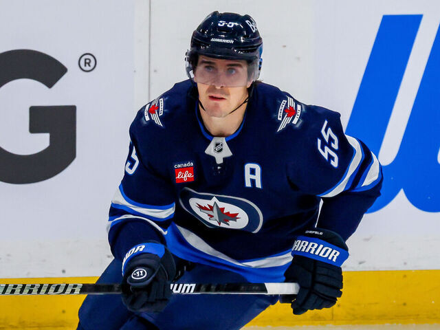 WINNIPEG, CANADA - APRIL 19: Mark Scheifele #55 of the Winnipeg Jets skates during third period action against the St. Louis Blues in Game One of the First Round of the 2025 Stanley Cup Playoffs at Canada Life Centre on April 19, 2025 in Winnipeg, Manitoba, Canada.