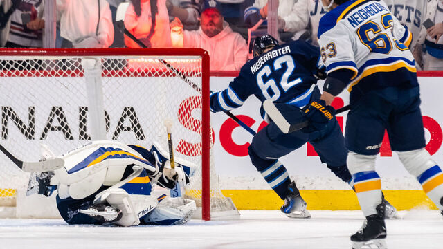 WINNIPEG, CANADA - APRIL 30: Nino Niederreiter #62 of the Winnipeg Jets scores a goal against Jordan Binnington #50 of the St. Louis Blues in the first period of Game Five of the First Round of the 2025 Stanley Cup Playoffs at Canada Life Centre on April 30, 2025 in Winnipeg, Canada.