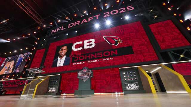 GREEN BAY, WISCONSIN - APRIL 25: A screen shows Michigan cornerback Will Johnson after being selected by the Arizona Cardinals with the 47th overall pick during the second round of the 2025 NFL Draft on April 25, 2025 in Green Bay, Wisconsin.