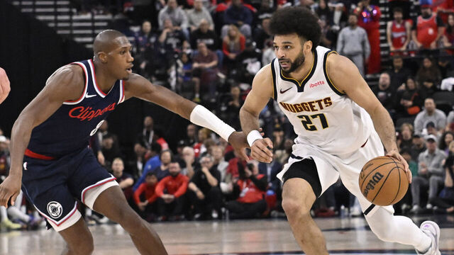 Inglewood, CA - April 26: Jamal Murray #27 of the Denver Nuggets drives to the basket against Kris Dunn #8 of the LA Clippers in the second half of game 4 of a NBA first round playoff basketball game at Intuit Dome in Inglewood on Saturday, April 26, 2025.