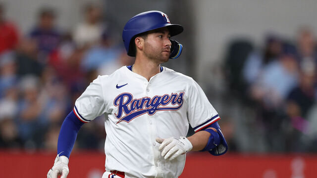 ARLINGTON, TEXAS - APRIL 28: Kyle Higashioka #11 of the Texas Rangers runs down the first base line during the third inning against the Athletics at Globe Life Field on April 28, 2025 in Arlington, Texas.