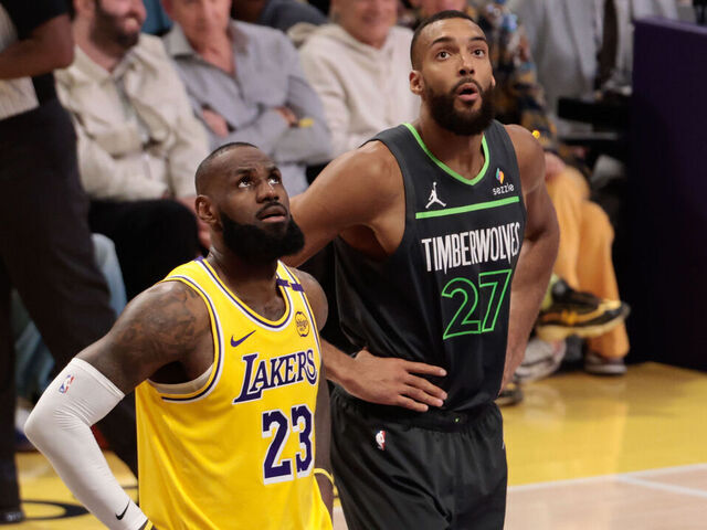 LOS ANGELES, CA - APRIL 30: Los Angeles Lakers forward LeBron James (23) with Minnesota Timberwolves center Rudy Gobert (27) during game 5 of the first round of the NBA Western Conference Playoffs between the Minnesota Timberwolves and the Los Angeles Lakers on April 30, 2025, at Crypto.com Arena in Los Angeles, CA.