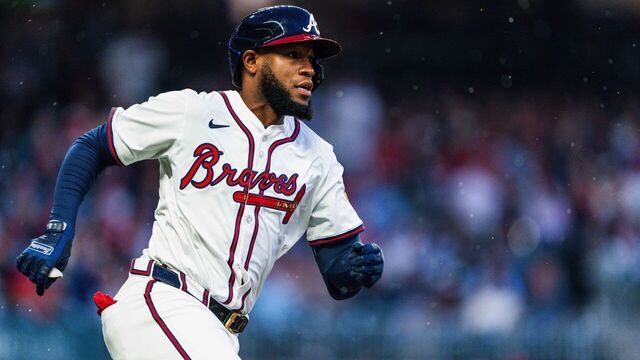 ATLANTA, GA - APRIL 10: Bryan De La Cruz #14 of the Atlanta Braves hits a double in the second inning against the Philadelphia Phillies at Truist Park on April 10, 2025 in Atlanta, Georgia.