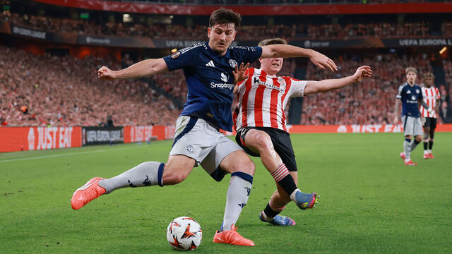 BILBAO, SPAIN - MAY 01: Harry Maguire of Manchester United is challenged by Daniel Vivian of Athletic Club during the UEFA Europa League 2024/25 Semi Final First Leg match between Athletic Bilbao and Manchester United at San Mames Stadium on May 01, 2025 in Bilbao, Spain.