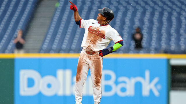 CLEVELAND, OH - MAY 01: Cleveland Guardians designated hitter Jose Ramirez (11) points to a graphic on the scoreboard after stealing second base during the tenth inning of the Major League Baseball game between the Minnesota Twins and Cleveland Guardians on May 1, 2025, at Progressive Field in Cleveland, OH. With the steal, Ramirez became the only active player and first Cleveland player with 250 home runs and 250 stolen bases.