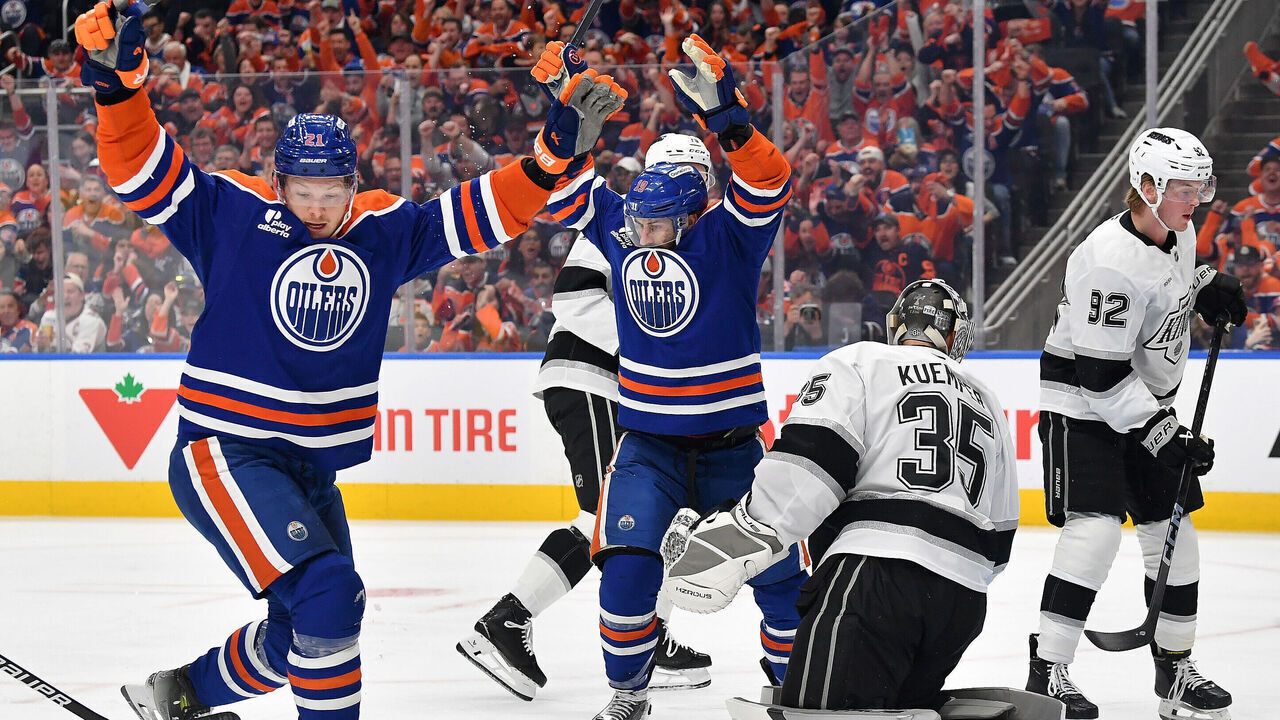 EDMONTON, CANADA - APRIL 27: Adam Henrique #19 and Trent Frederic #21 of the Edmonton Oilers celebrate a first-period goal against the Los Angeles Kings during Game Six of the First Round of the Stanley Cup Playoffs at Rogers Place on April 27, 2025, in Edmonton, Alberta, Canada.
