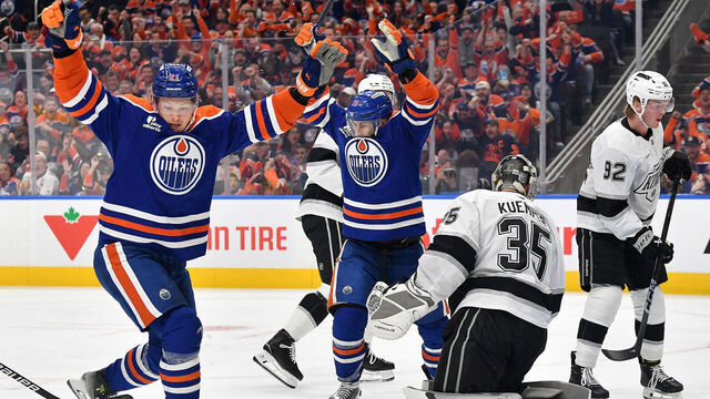 EDMONTON, CANADA - APRIL 27: Adam Henrique #19 and Trent Frederic #21 of the Edmonton Oilers celebrate a first-period goal against the Los Angeles Kings during Game Six of the First Round of the Stanley Cup Playoffs at Rogers Place on April 27, 2025, in Edmonton, Alberta, Canada.