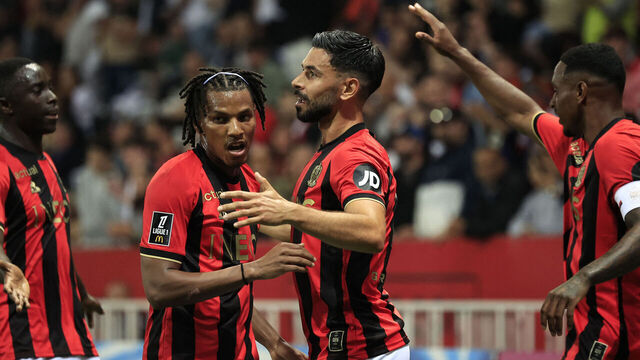 Nice's French midfielder #11 Morgan Sanson (CR) celebrates with teammates after scoring Nice's first goal during the French L1 football match between OGC Nice and Stade de Reims at the Allianz Riviera Stadium in Nice, south-eastern France, on May 2, 2025.