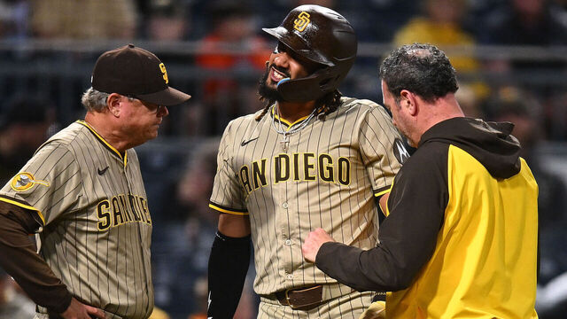 PITTSBURGH, PENNSYLVANIA - MAY 2: Fernando Tatis Jr. #23 of the San Diego Padres is looked at by training staff after being hit by a pitch during the third inning against the Pittsburgh Pirates at PNC Park on May 2, 2025 in Pittsburgh, Pennsylvania.