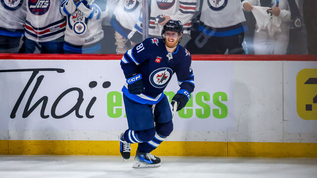 WINNIPEG, CANADA - APRIL 19: Kyle Connor #81 of the Winnipeg Jets skates along the boards to celebrate his third period goal against the St. Louis Blues in Game One of the First Round of the 2025 Stanley Cup Playoffs at Canada Life Centre on April 19, 2025 in Winnipeg, Manitoba, Canada.