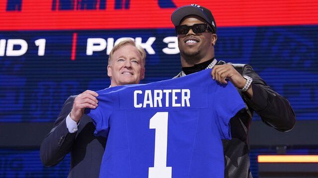 GREEN BAY, WISCONSIN - APRIL 24: Penn State defensive end Abdul Carter and Commissioner Roger Goodell pose after being selected third overall by the New York Giants during the first round of the 2025 NFL Draft on April 24, 2025 in Green Bay, Wisconsin.