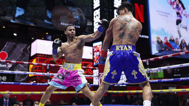 NEW YORK, NEW YORK - MAY 02: Rolly Romero lands a punch on Ryan Garcia during a fight for the WBA Welterweight title in Times Square on May 02, 2025 in New York City.
